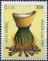 Colnect-2517-531-Cooking-over-open-fire.jpg